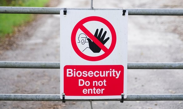 Biosecurity no entry sign on a metal gate